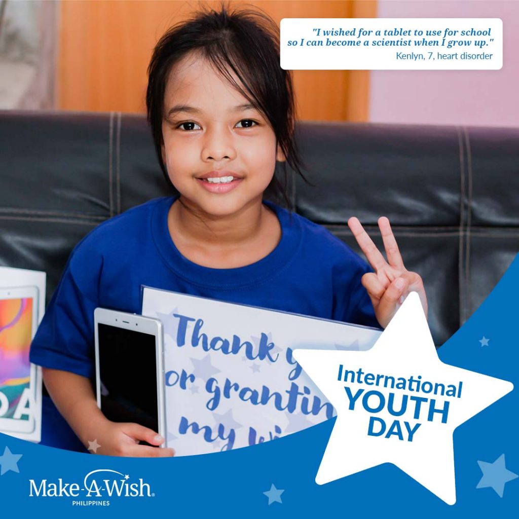 Young girl who wished for gadgets posing with a tablet and a peace sign from Make-A-Wish Philippines